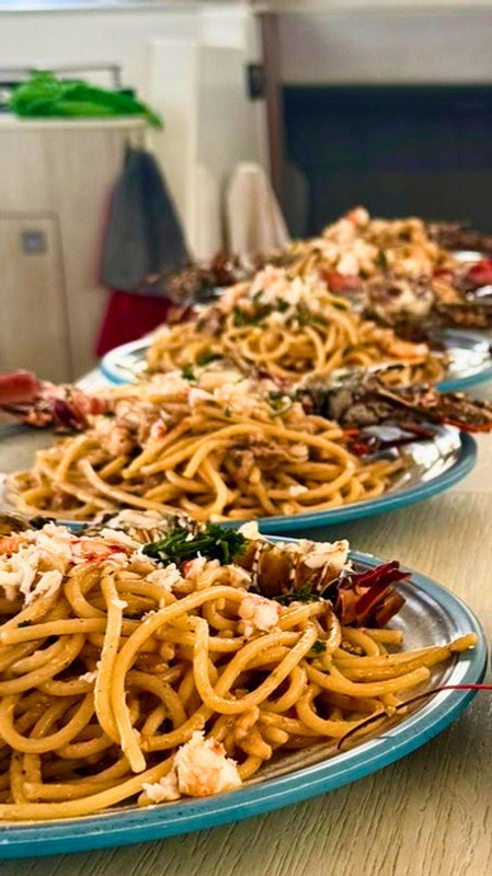 Lobster pasta served on board